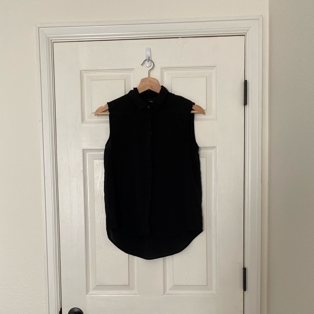 Black sleeveless blouse